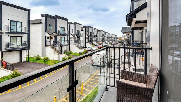 A modern residential building with a balcony, a covered walkway, and a view of the street. - Modern Elizabeth Apartment ~ 1 Mi to Train Station (Elizabeth)