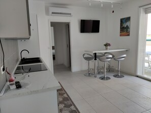 Apartamento, 2 quartos, varanda | Opções para refeição