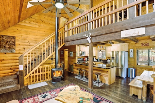 A real log cabin in the pines with a huge game room and a jacuzzi tub!