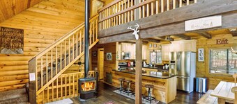 A real log cabin in the pines with a huge game room and a jacuzzi tub!