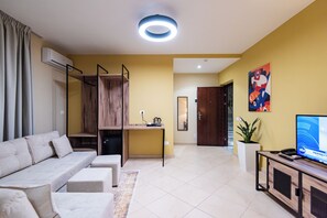 Comfort Room | Living area | 32-inch flat-screen TV with cable channels, Netflix, streaming services - ApartHotel EDA (Durrës)