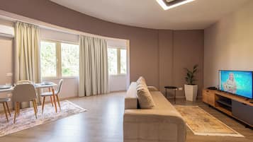 Superior Apartment | Living area | 32-inch flat-screen TV with cable channels, Netflix, streaming services