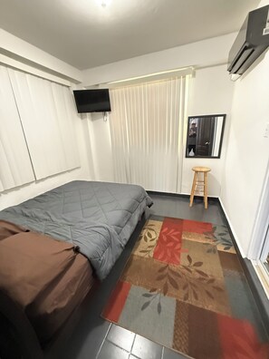 1 غرفة نوم ومكواة/لوح كي وواي فاي وملاءات أسرّة