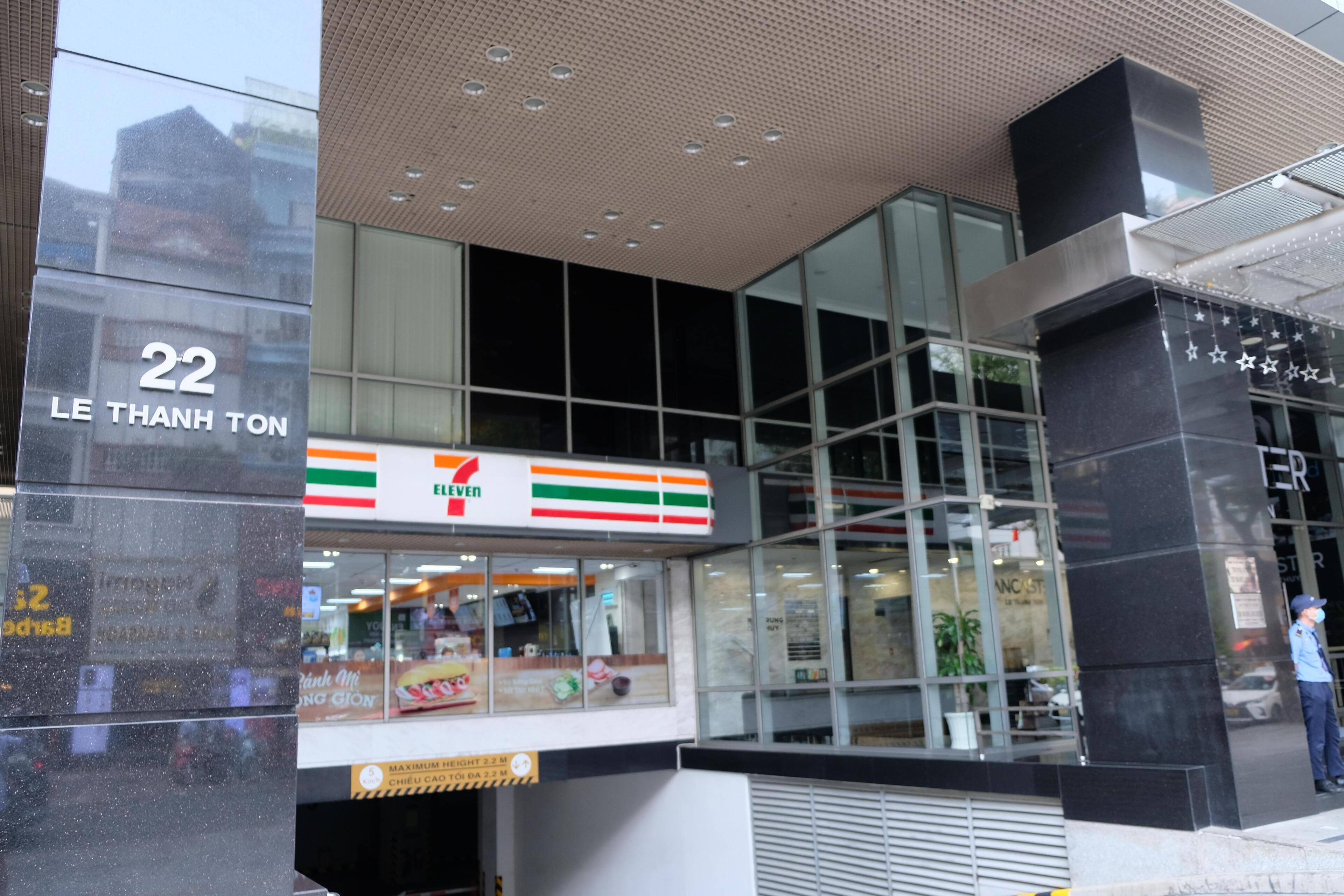 A 7-Eleven convenience store with a large glass facade and a sign indicating the store number 22.