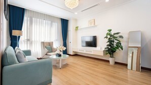Family Apartment, 2 Bedrooms | Living area | 55-inch Smart TV with digital channels, Netflix, streaming services - Spacious 2BR Lancaster (Ho Chi Minh City)