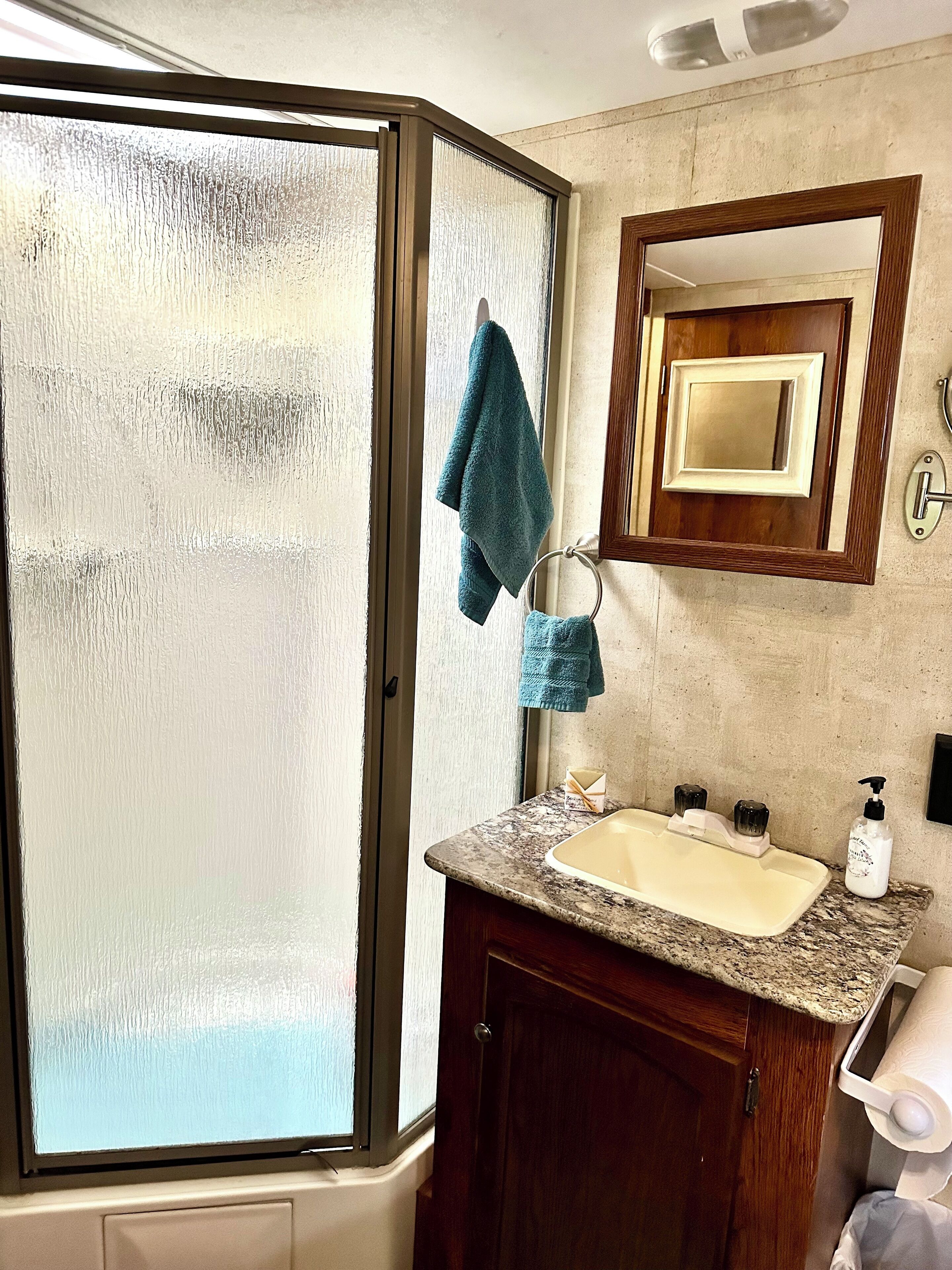 Shower, towels, soap, shampoo