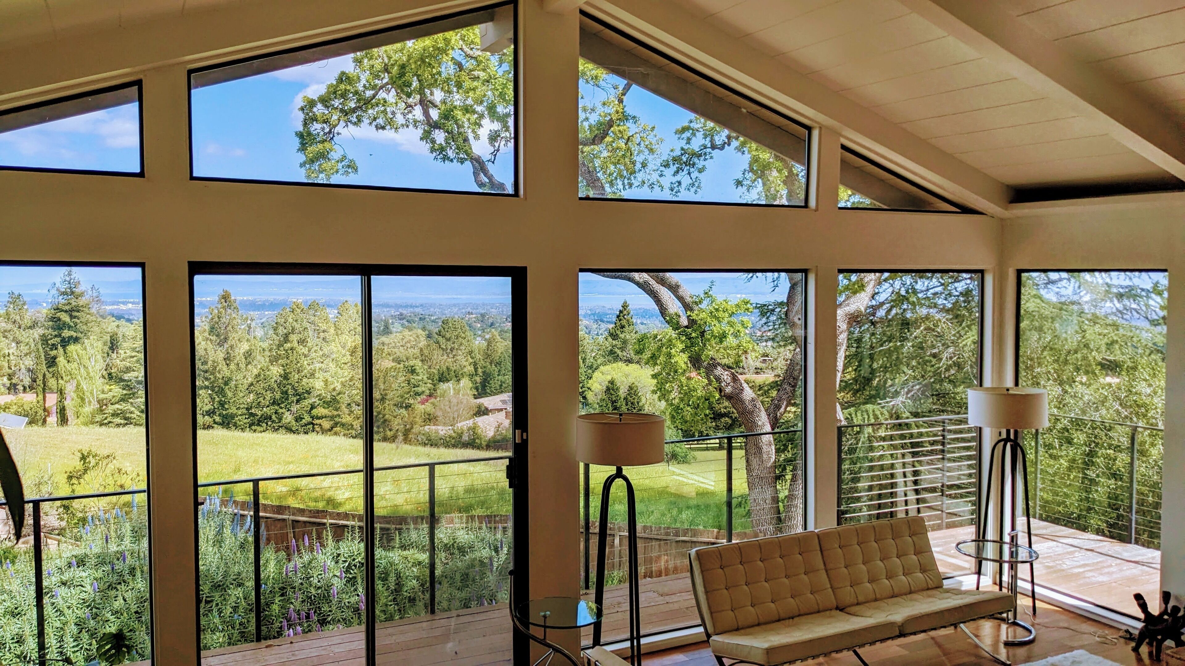 Huge, airy house with sweeping views, multiple patios, hot tub, car, and more!