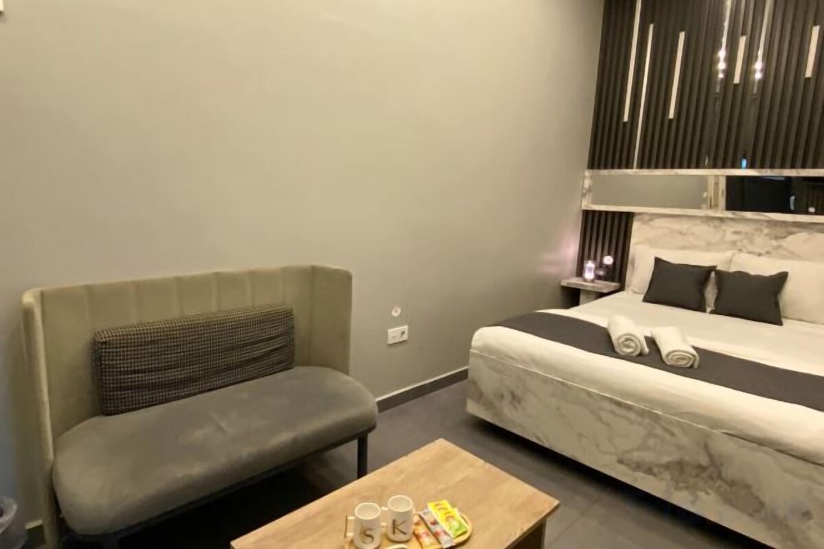 Premium bedding, memory foam beds, in-room safe, laptop workspace