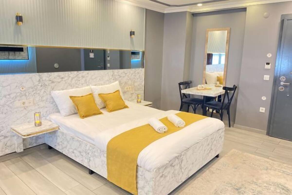 Premium bedding, memory foam beds, in-room safe, laptop workspace