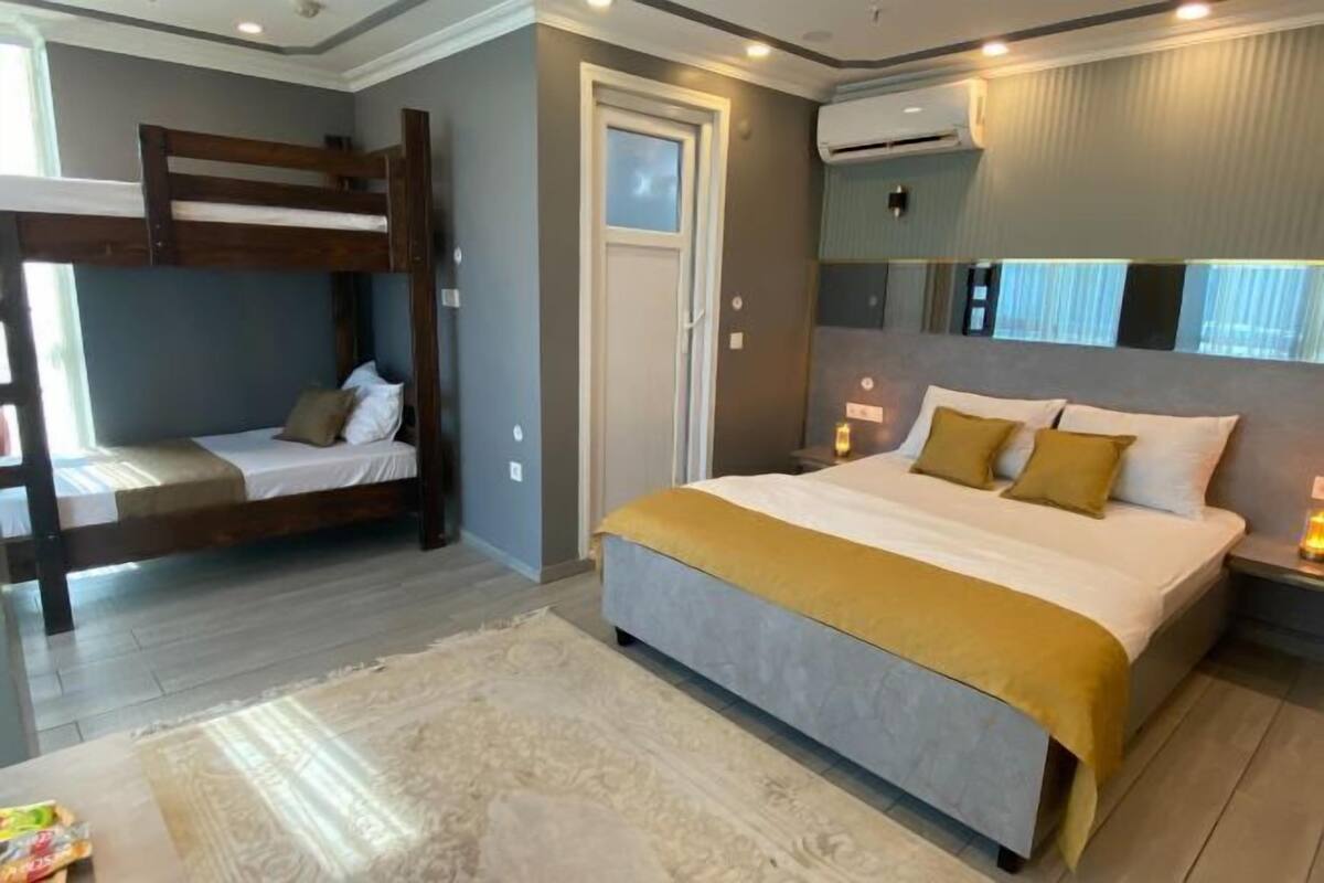 Premium bedding, memory foam beds, in-room safe, laptop workspace