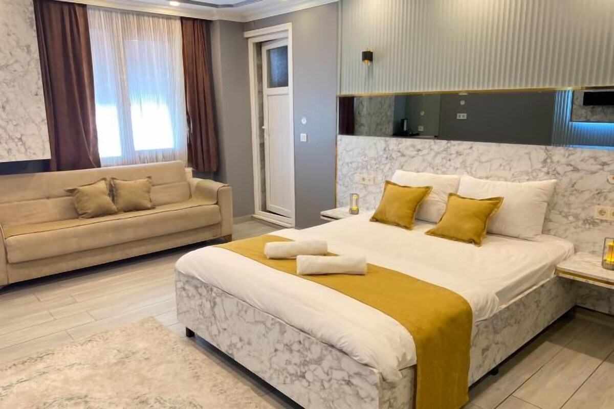 Premium bedding, memory foam beds, in-room safe, laptop workspace