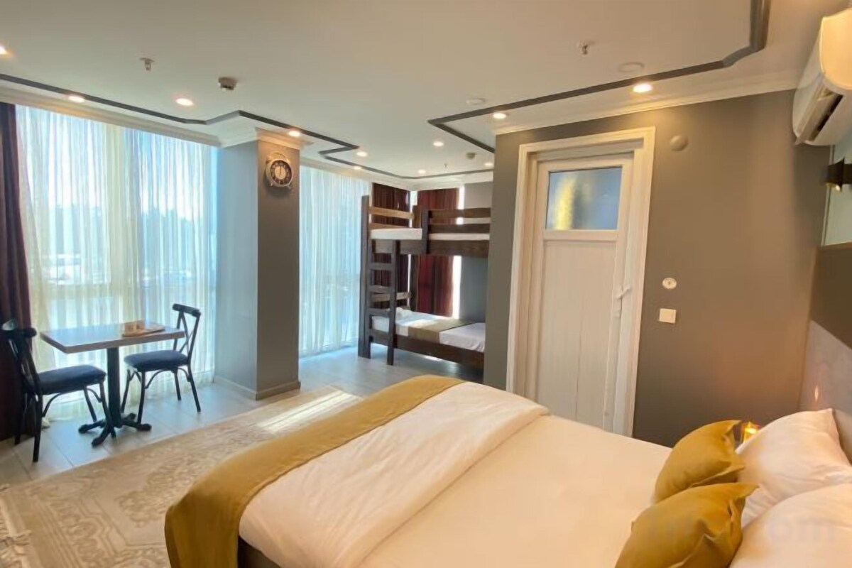 Premium bedding, memory foam beds, in-room safe, laptop workspace