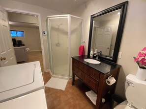 Shower, hair dryer, towels, soap