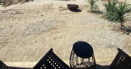 King Bed-Firepit-Shade-Chairs-Dark Skies