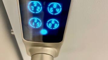 A digital keypad with illuminated numbers and a keypad interface.