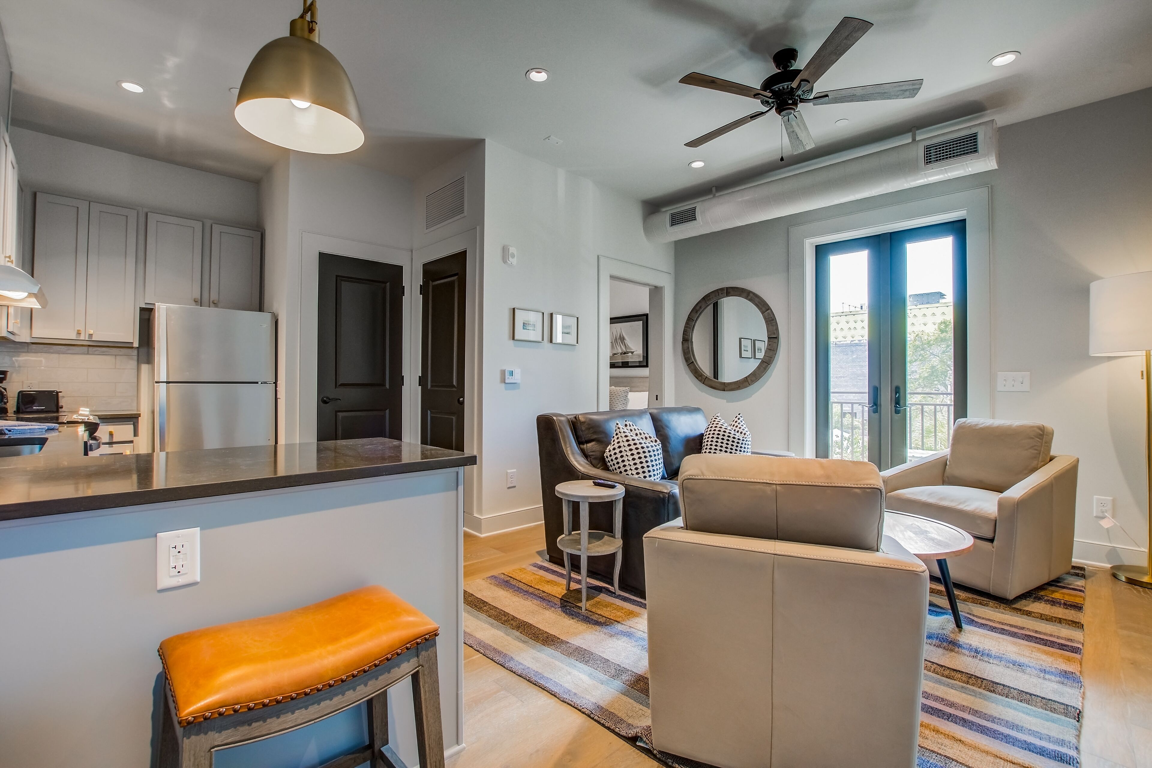 Wonderful downtown condo with a full kitchen, balcony, & rooftop deck