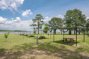 A park with picnic tables, a gazebo, and swings.