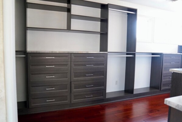 A modern storage unit with multiple drawers and shelves, likely used for organizing personal items.