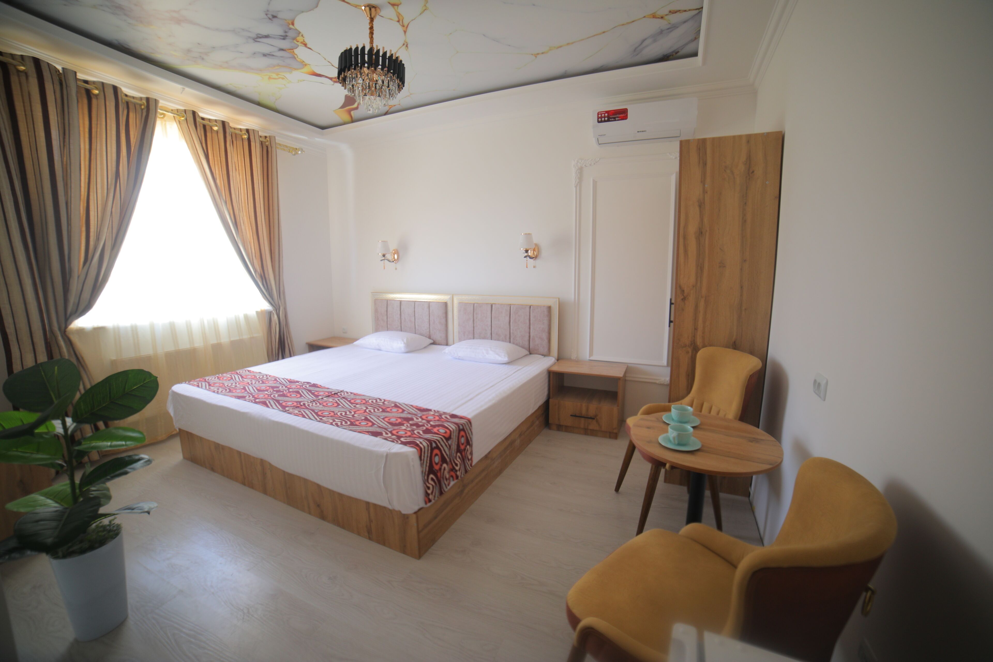 Economy Room, 1 King Bed, City View | 1 bedroom, minibar, iron/ironing board, free WiFi