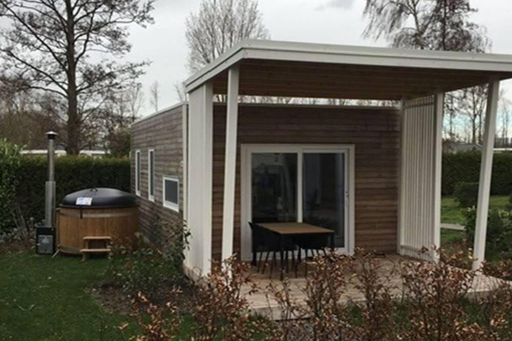 Tiny Cottage Hottub 2+2 by Interhome