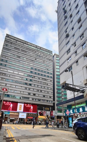 Stylish commercial building with shops on the ground floor, offering a variety of storefronts.