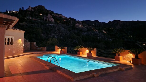 A swimming pool with a view of a mountainous landscape at dusk. - Spectacular mountain views in a romantic location. Close to Mojacar beaches. (Turre)