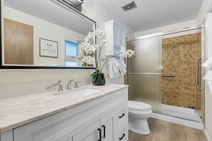 Shower, hair dryer, towels, shampoo