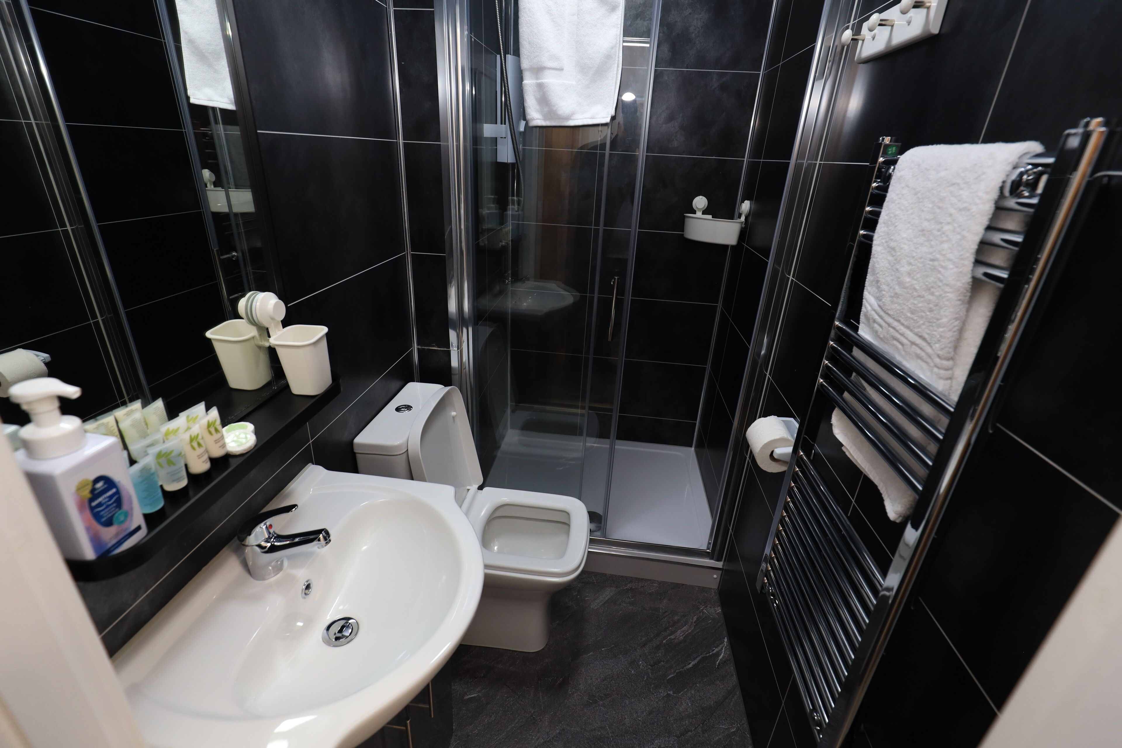 Shower, rainfall showerhead, hair dryer, towels