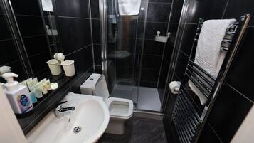 Shower, rainfall showerhead, hair dryer, towels