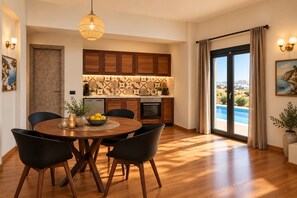 Dining room -  Golden Moments Luxury Stone Villas. (Santorini)
