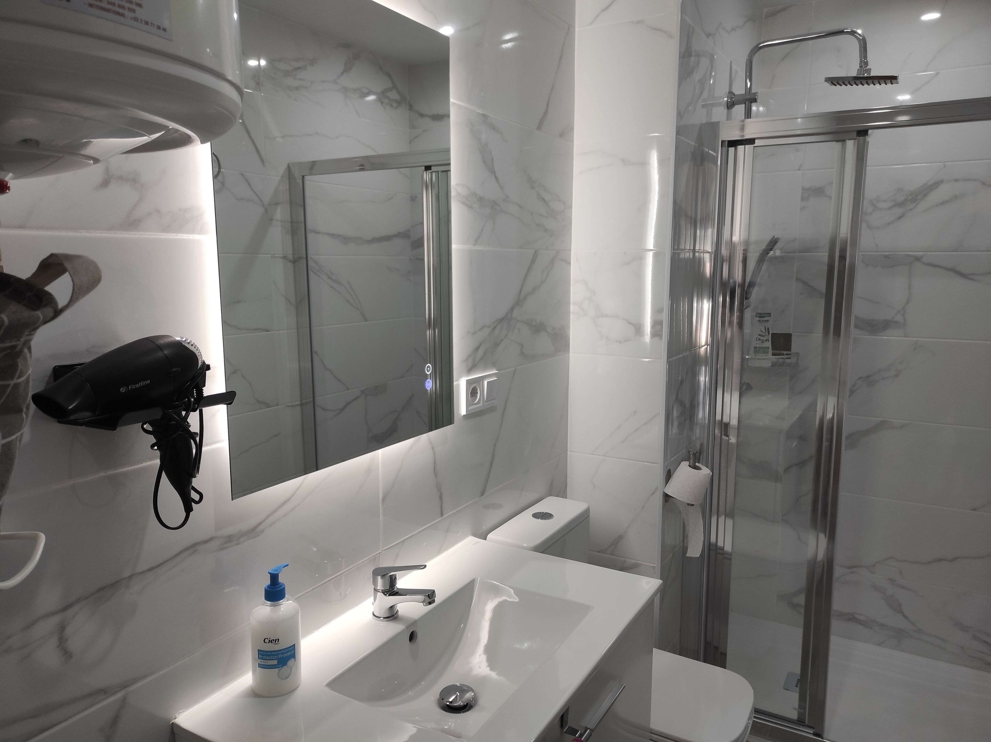 Shower, hair dryer, towels, soap