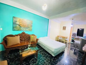 Economy Studio | 1 bedroom, individually furnished, desk - Carib Apartment (Malay)