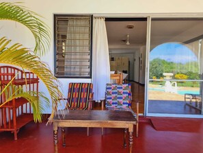 Deluxe Villa | Living area | 34-inch Smart TV with digital channels - Lux Suites Sanuna Villas Diani (Diani Beach)