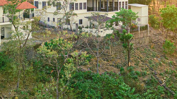 A two-story building with a flat roof, multiple windows, and a balcony. - Breathtaking Mountain Views in La Union, El Salvador. Escape to serenity (Anamorós)