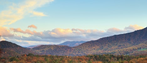 A mountainous landscape with autumn foliage.
