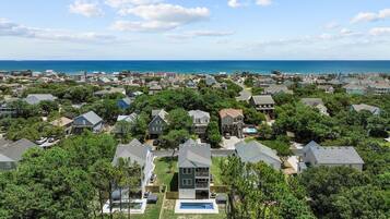 Residential area with diverse homes and a scenic waterfront view.