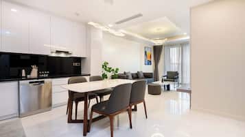 Deluxe Apartment, 2 Bedrooms, Kitchen, City View | Living area | 42-inch Smart TV with cable channels, Netflix, streaming services