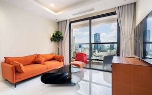 Deluxe Apartment, 3 Bedrooms, Kitchen, City View | Living area | 42-inch Smart TV with cable channels, Netflix, streaming services