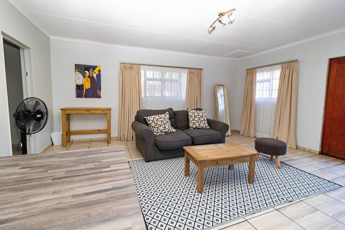 Luxury Apartment, Garden View | Living area | 21-inch TV with digital channels