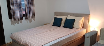 In a quiet part of the city, with a free parking space and a private terrace.