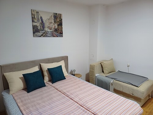 In a quiet part of the city, with a free parking space and a private terrace.