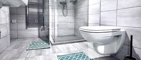 Shower, hair dryer, towels, soap