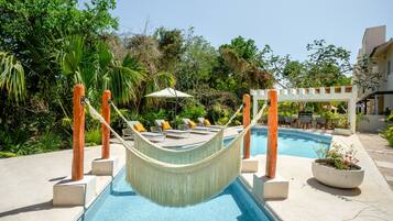 Outdoor pool, open 9:00 AM to 11:00 PM, pool umbrellas, pool loungers