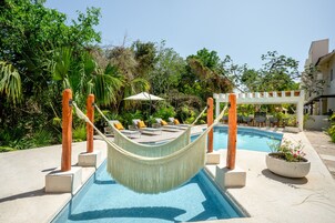 Outdoor pool, open 9:00 AM to 11:00 PM, pool umbrellas, sun loungers