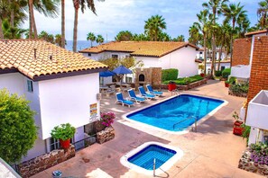 Outdoor pool, a heated pool - Cozy condo 2 minutes from the beach at a tennis resort gated community  (Playas de Rosarito)