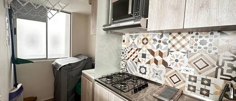 Fridge, microwave, stovetop, coffee/tea maker