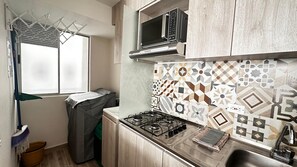 Fridge, microwave, stovetop, coffee/tea maker