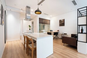 Deluxe Apartment, 1 King Bed, Kitchen, City View | Living area | 42-inch Smart TV with cable channels, Netflix, streaming services