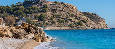 On the beach, sun-loungers, beach towels