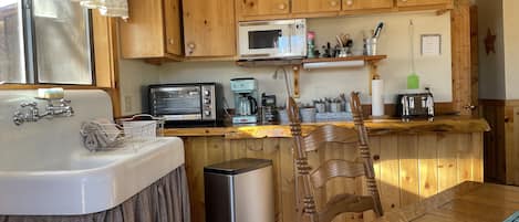 Fridge, microwave, coffee/tea maker, toaster